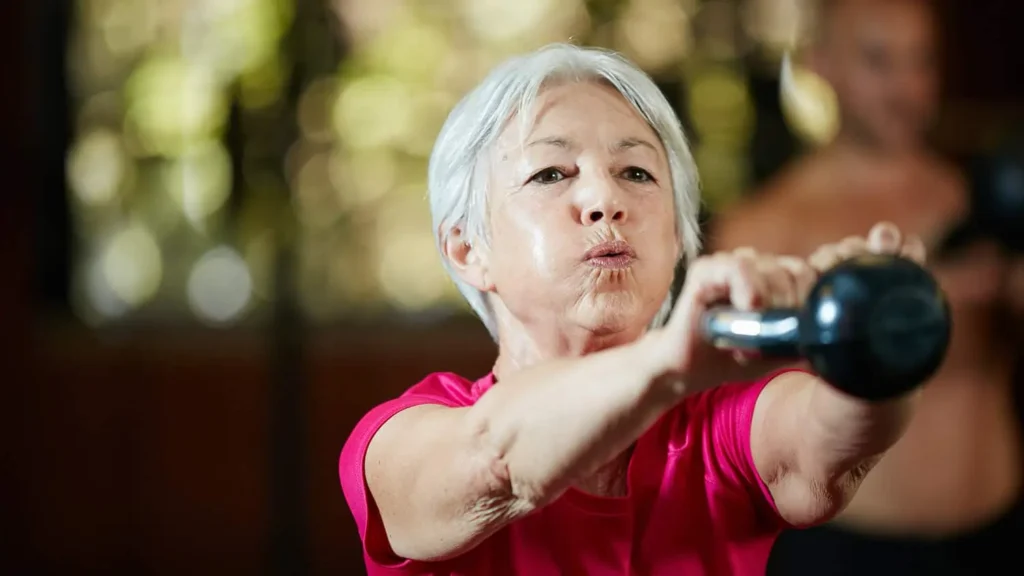Toning Bingo Wings: Effective Exercises and Tips for Achieving Sleeker Arms 2 Person performing arm exercises with dumbbells Hillingdon