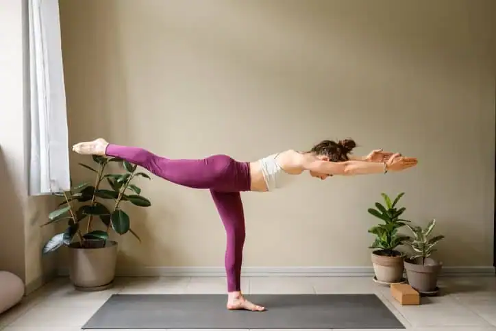 Achieving the Perfect Tone: How Often Should You Exercise for Results? 1 Woman doing Yoga exercise Hillingdon to help with toning the body.